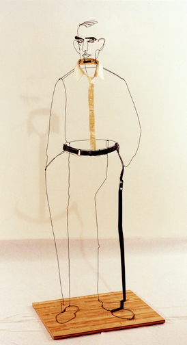 Figurative wire sculpture of standing man with yellow shirt
